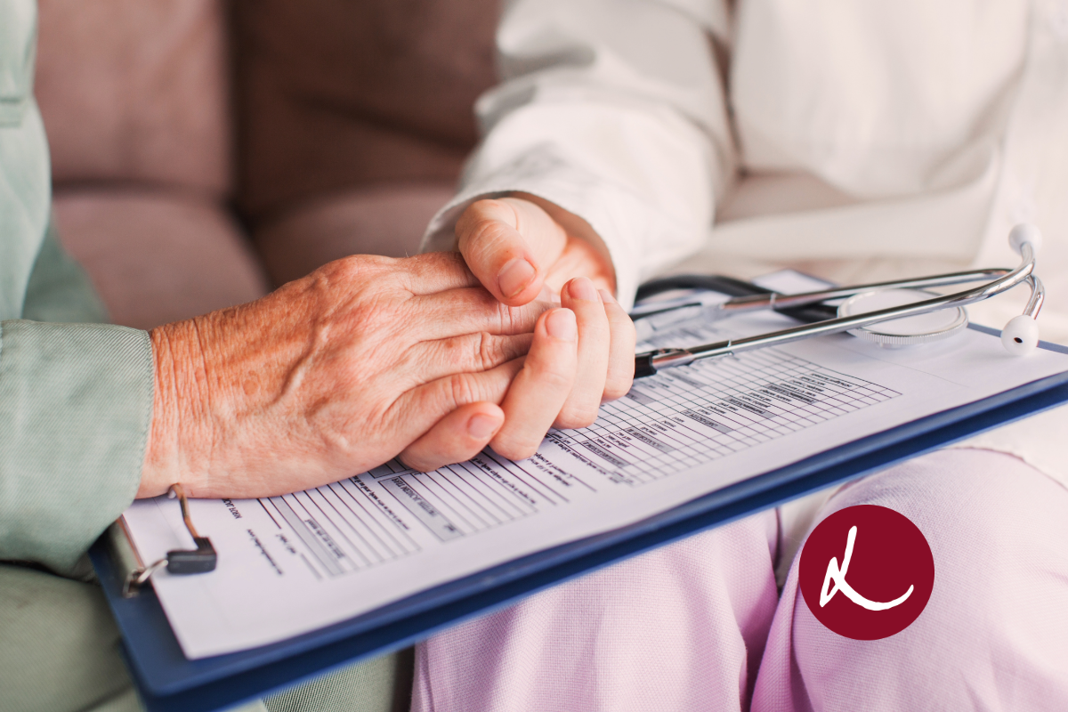 doctor holding patients hand