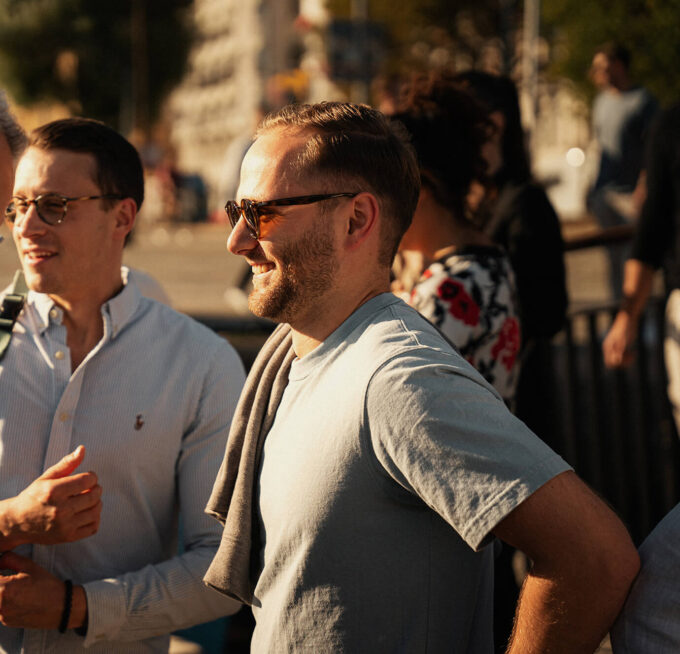 Two men smiling in conversation