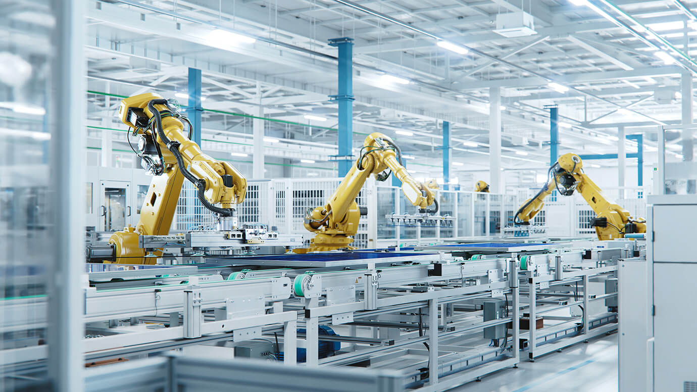 Industrial Robot arms on a factory assembly line