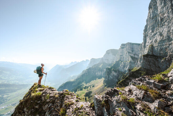 Mission & Vision Hiker traveling up a mountain with summit in view