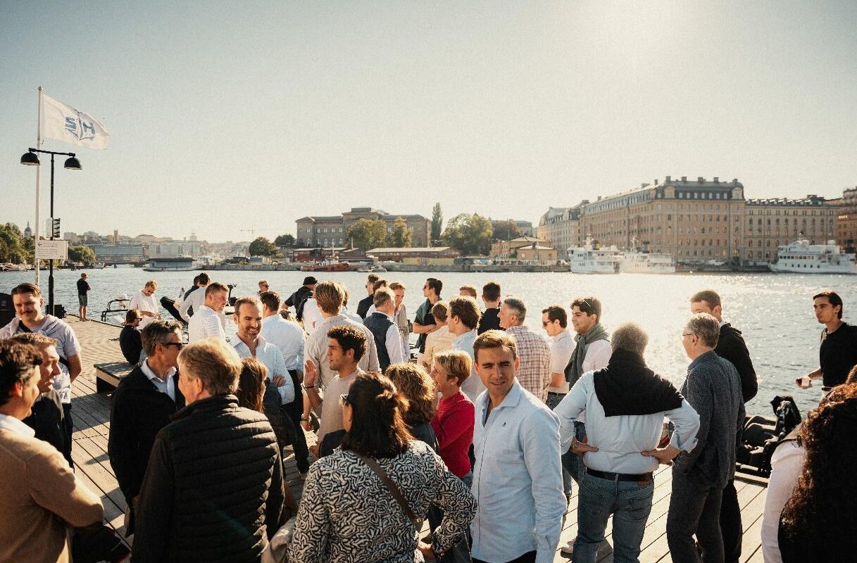 Group of Livingstone Employees enjoying a gathering on a dock