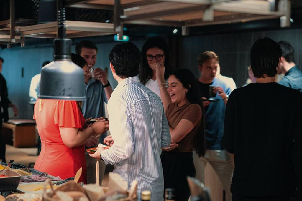 Livingstone employees enjoying a group meal at a party